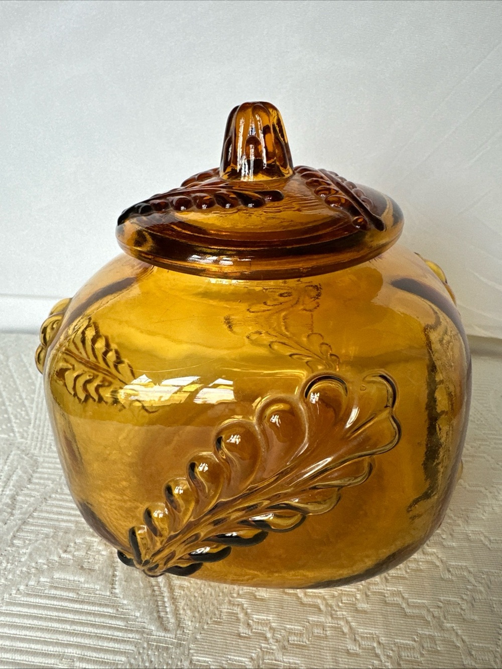 Amber Glass Jar/ Lid  with Decorative Leaf Motif Decor for any room.